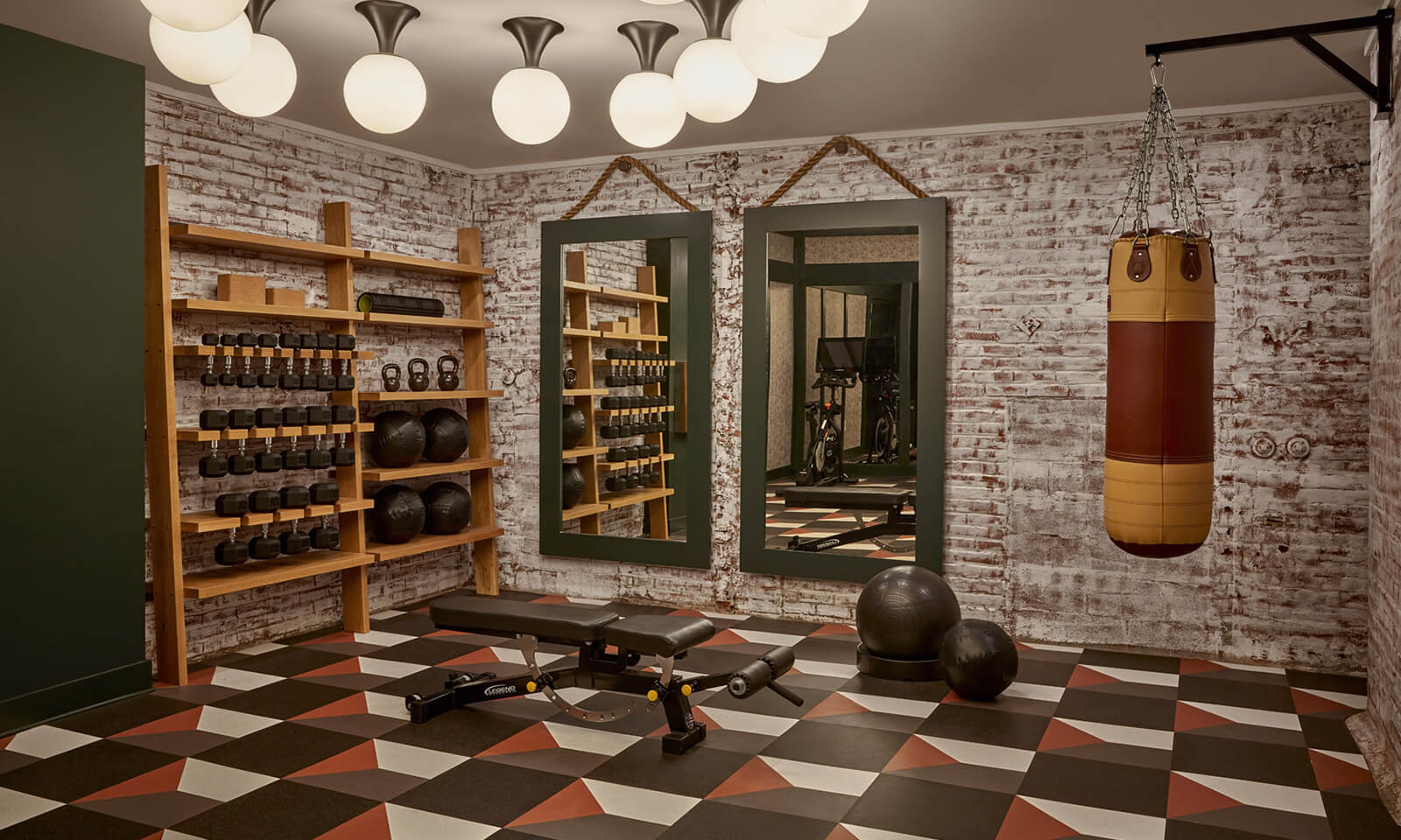 Weight room with black speckled flooring